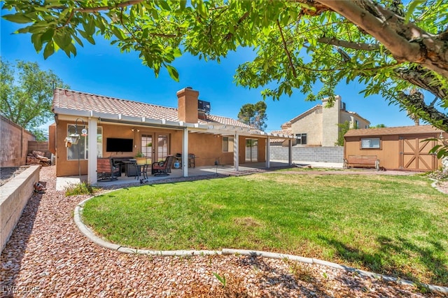 819 Arrowhead Trl, Henderson, NV 89002 - rear view of house featuring a storage unit, a chimney, a tiled roof, an outdoor structure, and a pergola