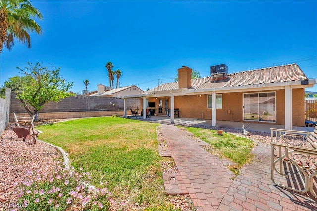 819 Arrowhead Trl, Henderson, NV 89002 - rear view of house with central air condition unit, a chimney, stucco siding, and a patio