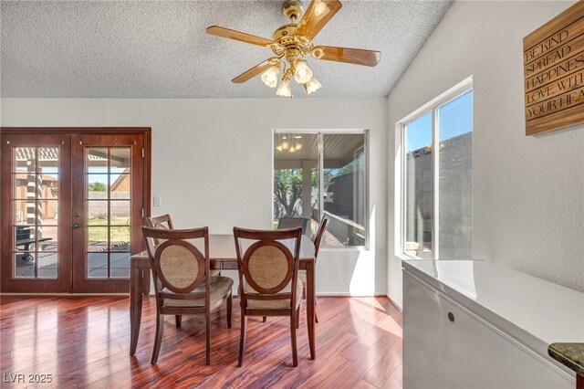 819 Arrowhead Trl, Henderson, NV 89002 - dining area featuring a textured ceiling, french doors, wood finished floors, and ceiling fan