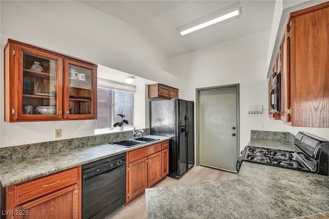 819 Arrowhead Trl, Henderson, NV 89002 - kitchen featuring black appliances, vaulted ceiling, light wood finished floors, a sink, and glass insert cabinets