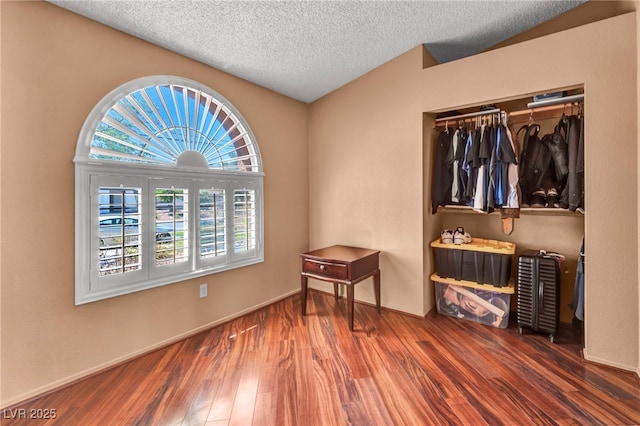 819 Arrowhead Trl, Henderson, NV 89002 - bedroom featuring wood finished floors, a textured ceiling, baseboards, and a closet