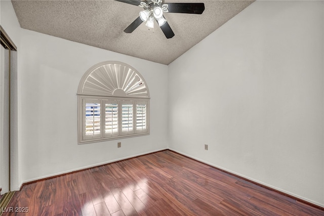 819 Arrowhead Trl, Henderson, NV 89002 - unfurnished room featuring vaulted ceiling, a ceiling fan, a textured ceiling, and wood finished floors