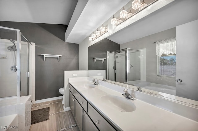 819 Arrowhead Trl, Henderson, NV 89002 - bathroom featuring a stall shower, a garden tub, double vanity, and toilet