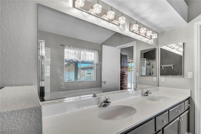 819 Arrowhead Trl, Henderson, NV 89002 - bathroom featuring a textured wall, a garden tub, and double vanity