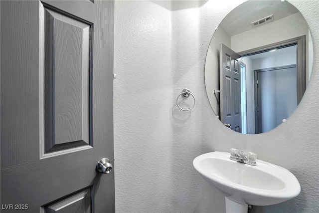 5740 Winter Cherry St, Las Vegas, NV 89130 - bathroom with a sink and a textured wall