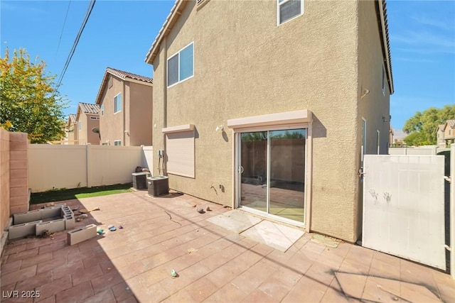 5740 Winter Cherry St, Las Vegas, NV 89130 - back of house featuring stucco siding and a patio