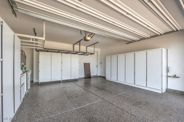 garage featuring baseboards and a garage door opener