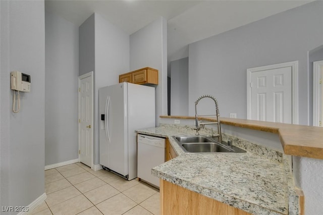 8675 Traveling Breeze Ave Unit 101, Las Vegas, NV 89178 - kitchen featuring white appliances, a sink, light countertops, light tile patterned flooring, and baseboards