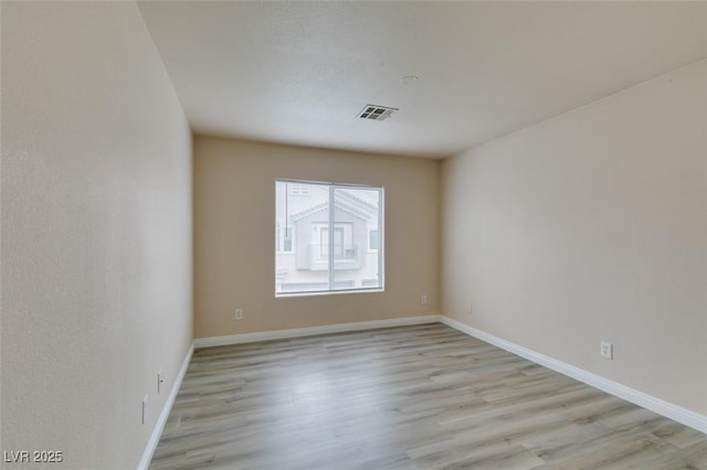8675 Traveling Breeze Ave Unit 101, Las Vegas, NV 89178 - empty room with light wood-style flooring and baseboards