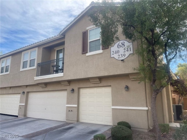 6255 W Arby Ave Unit 239, Las Vegas, NV 89118 - multi unit property featuring stucco siding, a balcony, and a garage