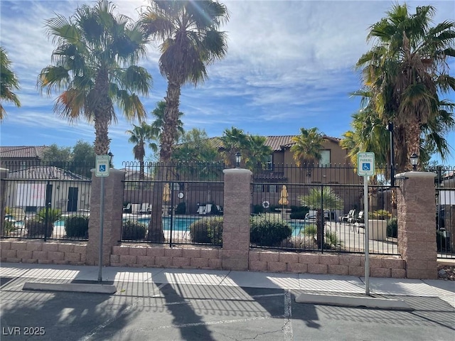 6255 W Arby Ave Unit 239, Las Vegas, NV 89118 - gate with fence and a community pool
