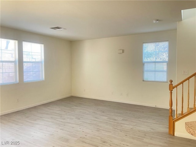 6255 W Arby Ave Unit 239, Las Vegas, NV 89118 - spare room featuring wood finished floors, stairs, baseboards, and a smoke detector