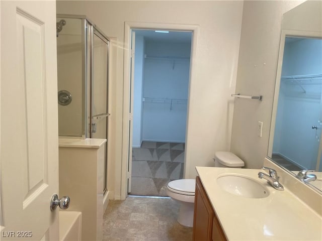 6255 W Arby Ave Unit 239, Las Vegas, NV 89118 - bathroom with a shower stall, toilet, vanity, and a walk in closet
