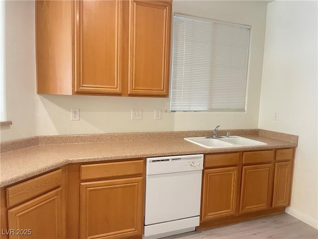 6255 W Arby Ave Unit 239, Las Vegas, NV 89118 - kitchen featuring dishwasher, a sink, light wood finished floors, and light countertops