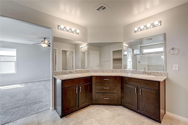 bathroom featuring double vanity, baseboards, ceiling fan, and tile patterned flooring