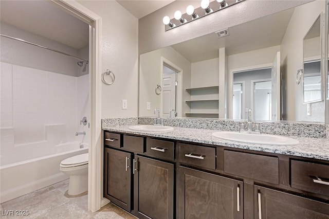 full bath with toilet, double vanity, and bathing tub / shower combination