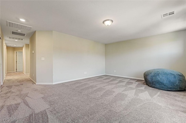unfurnished room with carpet flooring and baseboards