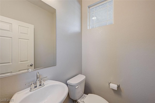 bathroom with a sink and toilet