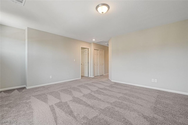 spare room featuring carpet flooring, baseboards, and recessed lighting