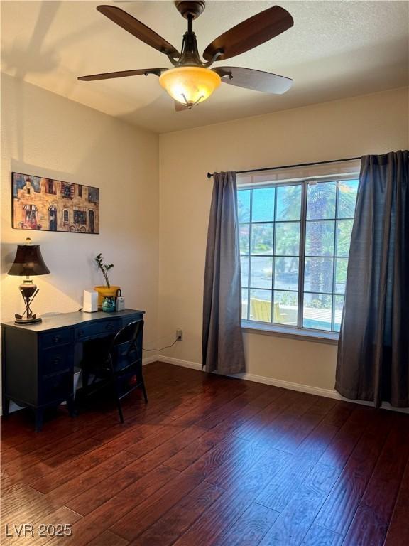 office featuring hardwood / wood-style floors, baseboards, and a ceiling fan