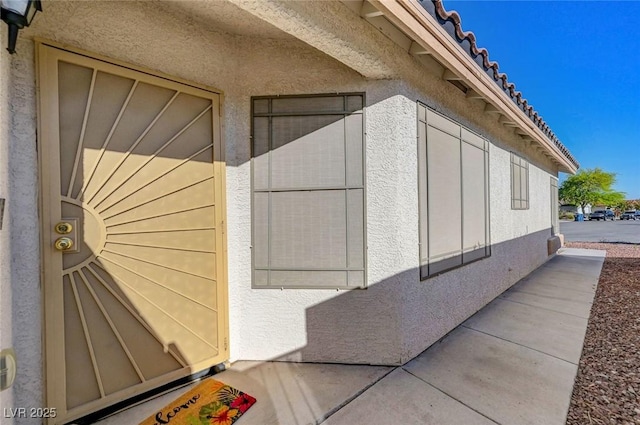view of property exterior with stucco siding