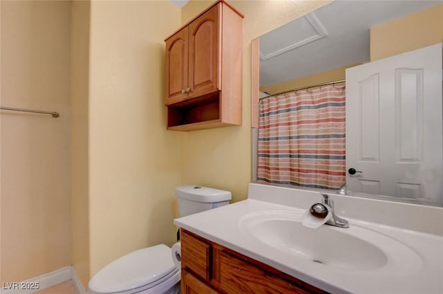bathroom with toilet, vanity, and a shower with shower curtain