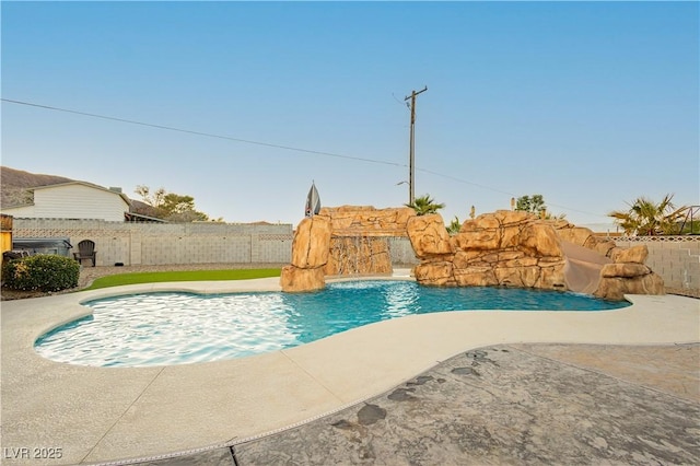 200 E Desert Rose Dr, Henderson, NV 89015 - view of pool with fence, a water slide, and a patio area