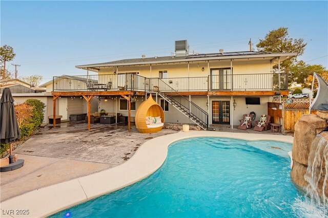 200 E Desert Rose Dr, Henderson, NV 89015 - back of house featuring french doors, a patio, fence, stairs, and an outdoor pool