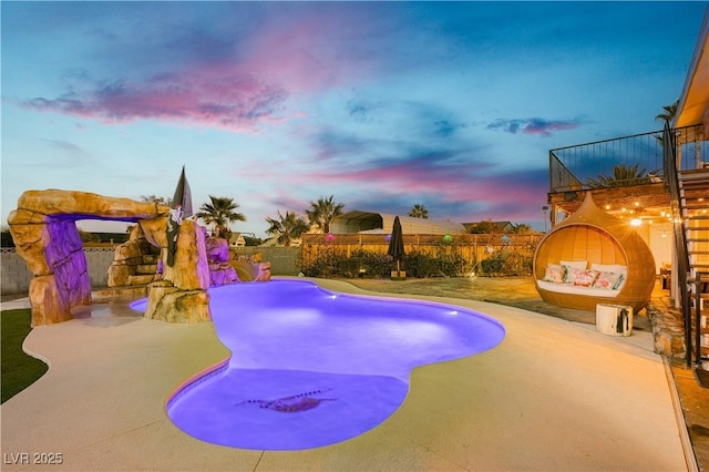 200 E Desert Rose Dr, Henderson, NV 89015 - pool at dusk with a fenced backyard and a patio