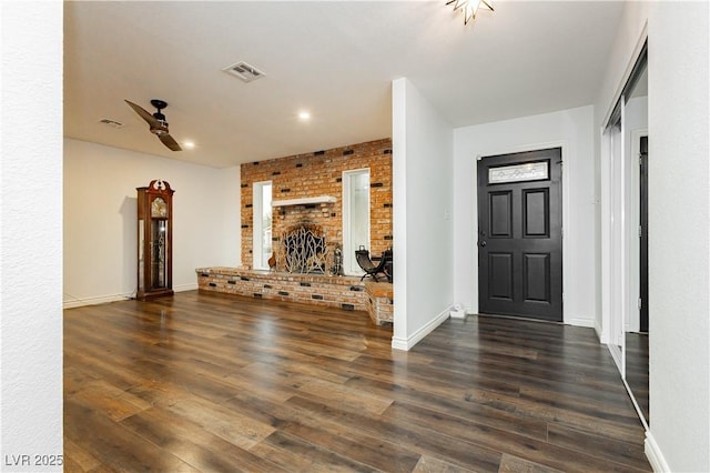 200 E Desert Rose Dr, Henderson, NV 89015 - unfurnished living room with wood finished floors, baseboards, ceiling fan, a fireplace, and recessed lighting