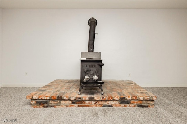 200 E Desert Rose Dr, Henderson, NV 89015 - detailed view of a wood stove, carpet flooring, and baseboards