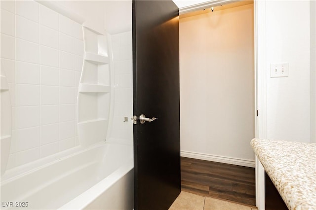 200 E Desert Rose Dr, Henderson, NV 89015 - bathroom featuring baseboards, tile patterned flooring, and shower / tub combination