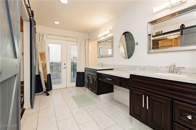200 E Desert Rose Dr, Henderson, NV 89015 - bathroom featuring french doors, marble look tiles, recessed lighting, and vanity