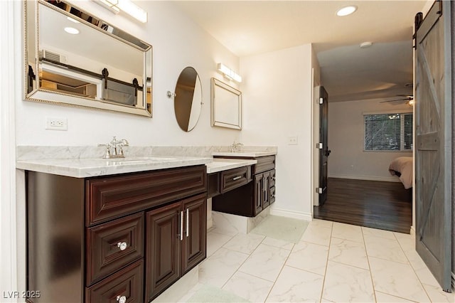 200 E Desert Rose Dr, Henderson, NV 89015 - ensuite bathroom featuring vanity, marble look tiles, baseboards, a ceiling fan, and recessed lighting