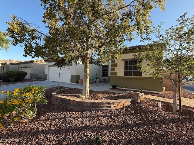 6617 Johnny Love Ln, North Las Vegas, NV 89086 - view of front facade featuring concrete driveway and stucco siding