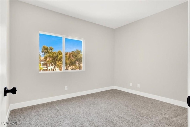 5655 E Sahara Ave Unit 2009, Las Vegas, NV 89142 - carpeted empty room with baseboards