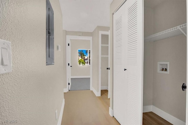 5655 E Sahara Ave Unit 2009, Las Vegas, NV 89142 - hall with wood finished floors, baseboards, and a textured wall