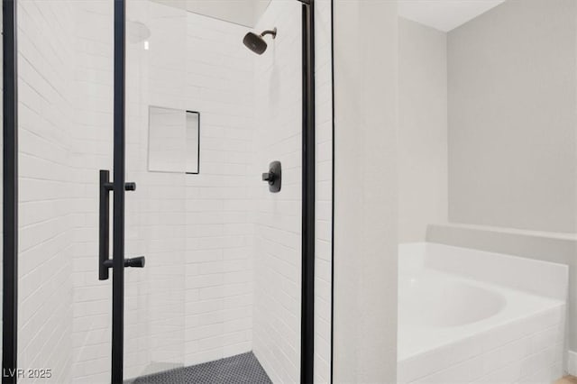 5655 E Sahara Ave Unit 2009, Las Vegas, NV 89142 - full bathroom with a shower stall and a garden tub
