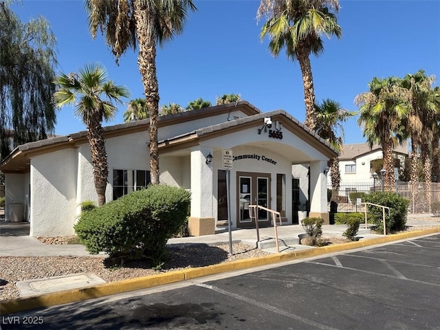 5655 E Sahara Ave Unit 2009, Las Vegas, NV 89142 - view of building exterior featuring fence and uncovered parking