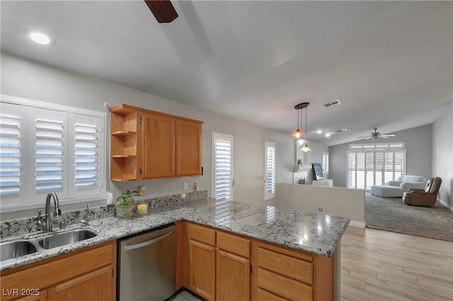 5553 Super Bowl Dr, Las Vegas, NV 89110 - kitchen featuring stainless steel dishwasher, a ceiling fan, a sink, a peninsula, and light wood-style flooring