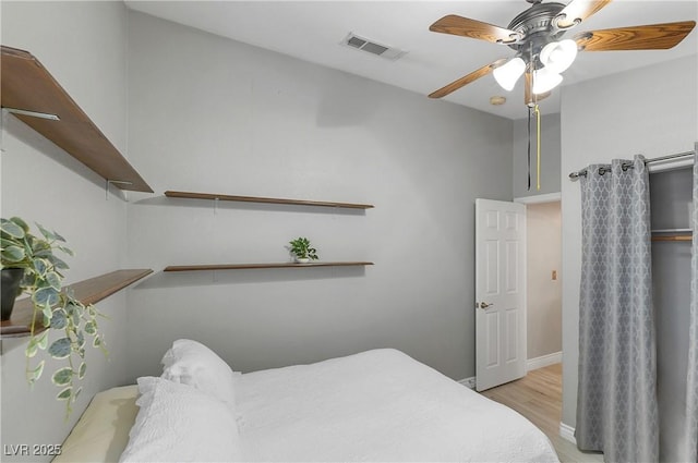 5553 Super Bowl Dr, Las Vegas, NV 89110 - bedroom with light wood-type flooring, a ceiling fan, and baseboards