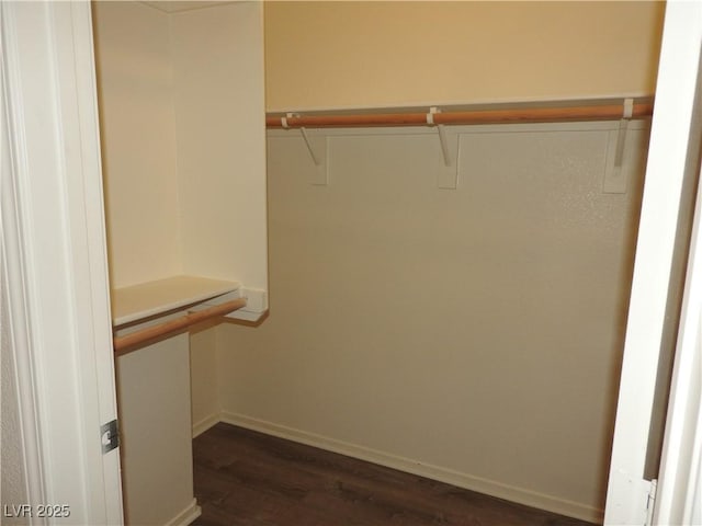 9470 Peace Way Unit 112, Las Vegas, NV 89147 - spacious closet featuring dark wood-style flooring
