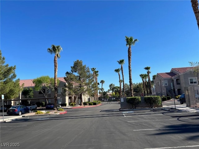 9470 Peace Way Unit 112, Las Vegas, NV 89147 - view of asphalt road featuring curbs, a residential view, and sidewalks
