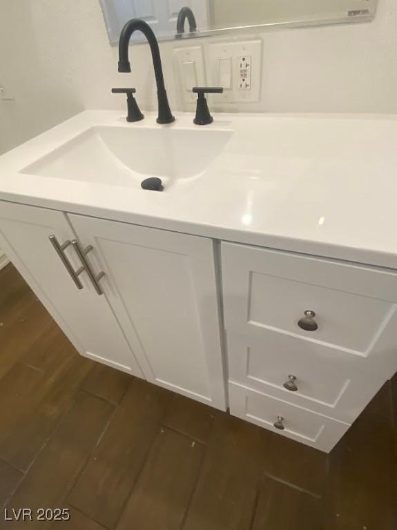 4910 Elizabeth St, Pahrump, NV 89048 - bathroom view of wood finished floors and vanity