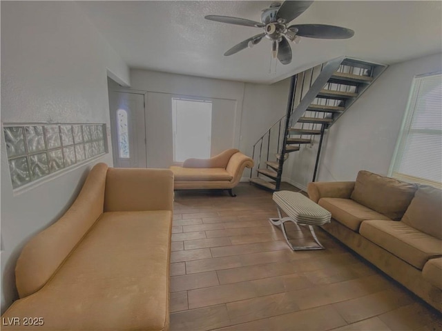 4910 Elizabeth St, Pahrump, NV 89048 - living area featuring stairs, ceiling fan, and wood finished floors