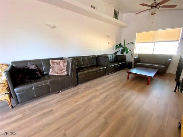 4910 Elizabeth St, Pahrump, NV 89048 - living area featuring a ceiling fan, wood finished floors, and a high ceiling