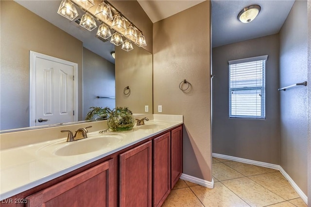 full bath featuring baseboards, tile patterned flooring, and double vanity