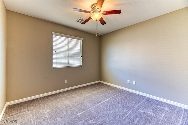 empty room featuring carpet flooring, a ceiling fan, and baseboards