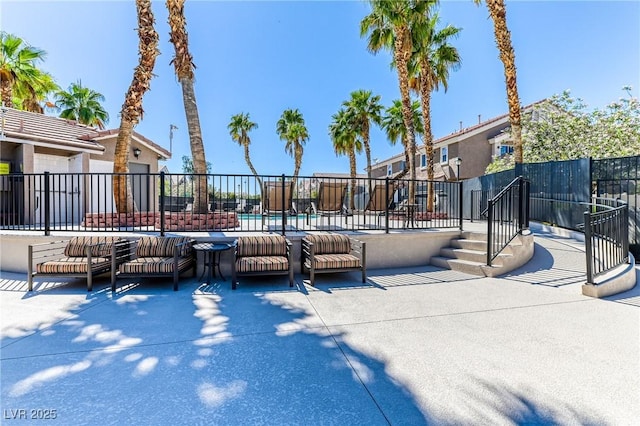 surrounding community featuring fence, a pool, and a patio