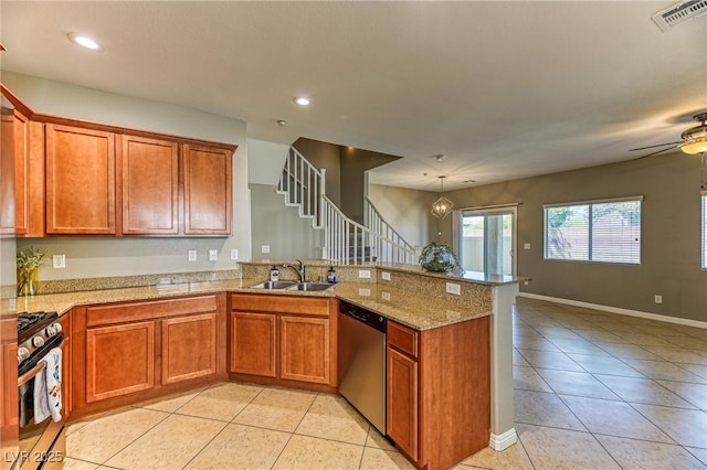 kitchen with stainless steel appliances, a sink, light tile patterned flooring, a peninsula, and brown cabinetry